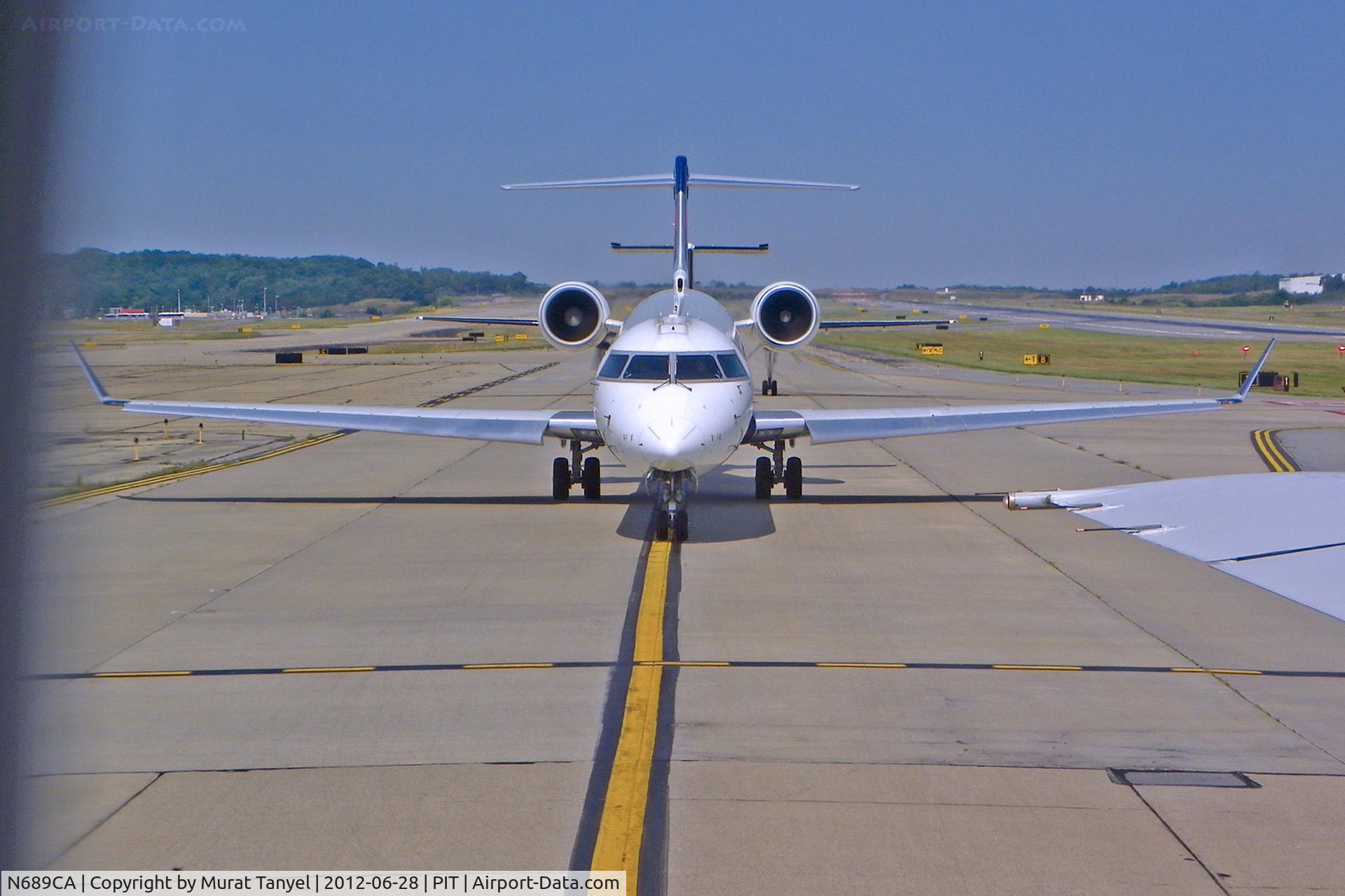 N689CA, 2007 Bombardier CRJ-900ER (CL-600-2D24) C/N 15133, #2 for take-off at PIT.
