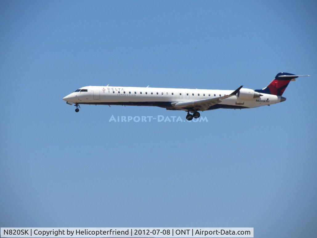 N820SK, 2006 Bombardier CRJ-900ER (CL-600-2D24) C/N 15108, On 1/2 mile final for 26R
