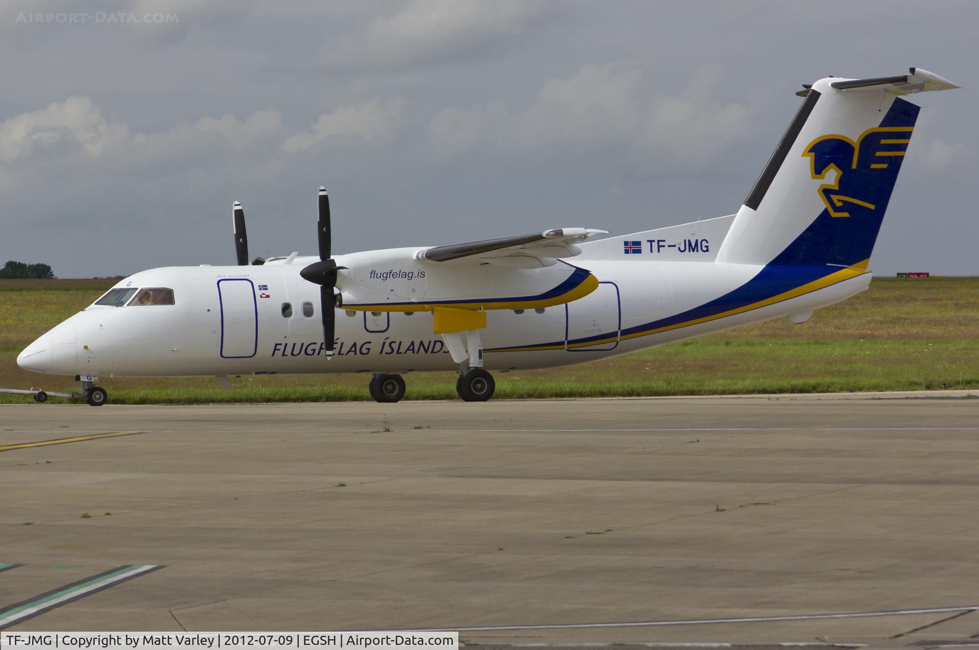 TF-JMG, 1996 De Havilland Canada DHC-8-202 Dash 8 C/N 445, Being towed to stand 8 after spray by Air Livery.