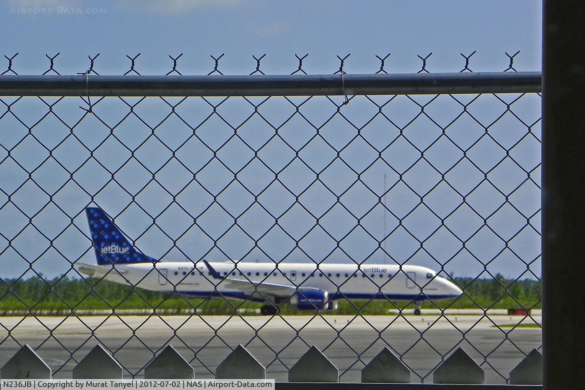 N236JB, 2006 Embraer 190AR (ERJ-190-100IGW) C/N 19000035, Photographed from behind bars at Nassau Intl