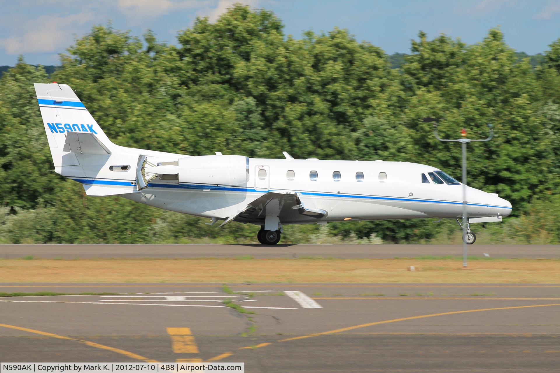 N590AK, 1999 Cessna 560XL Citation Excel C/N 560-5038, Touchdown on runway 20 after its flight from Burlington, VT (KBTV).