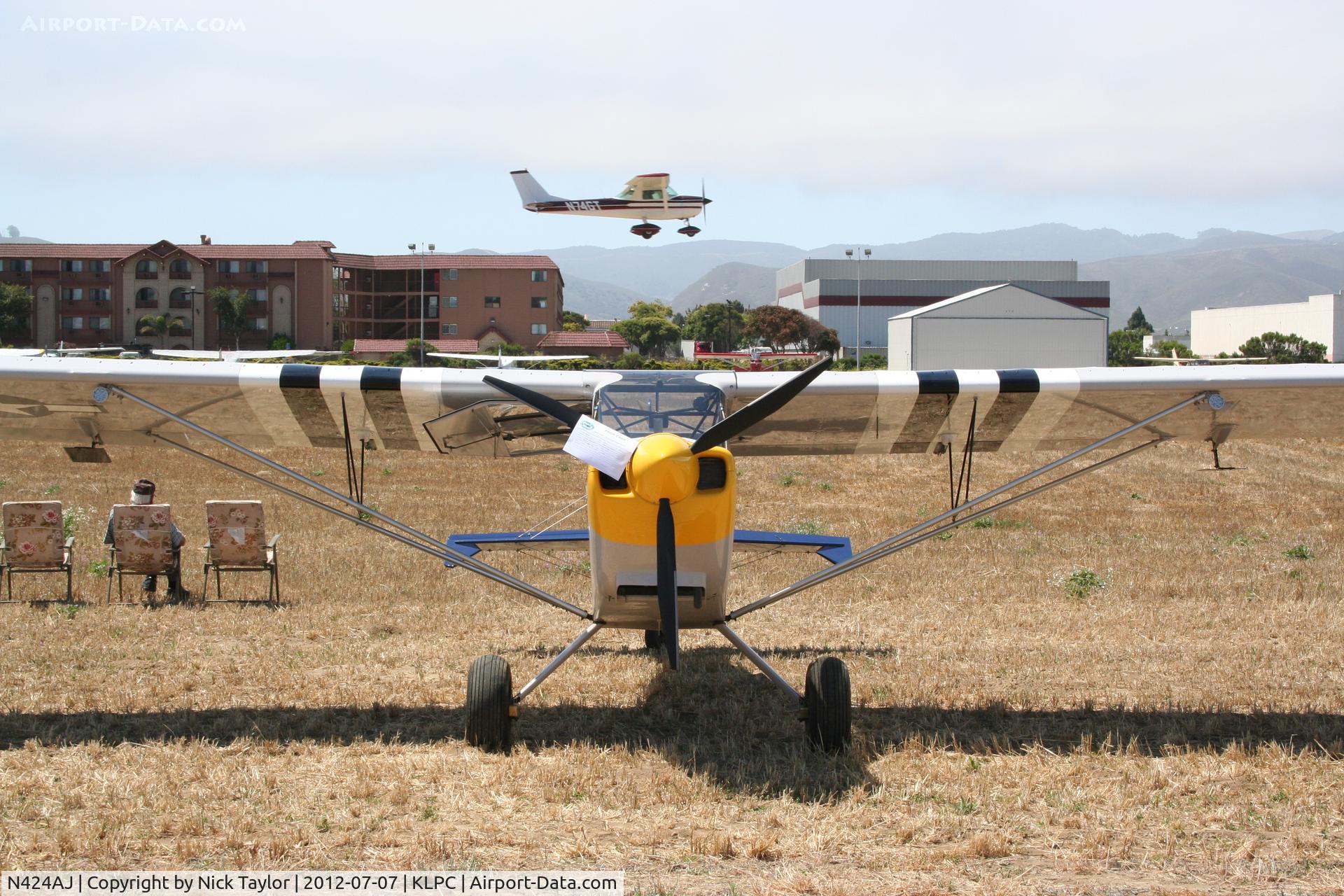 N424AJ, 2007 Rans S-7 Courier C/N 0107450, N74GT lands behind. Lompoc Piper Cub fly in 2012