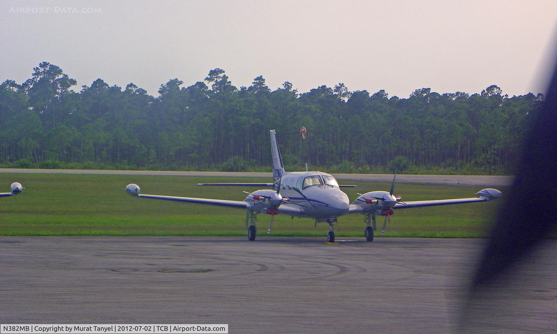 N382MB, 1982 Piper PA-31T Cheyenne C/N 31T-8120057, Parked at Treasure Cay Intl, taken behind the propeller of C6-BFO