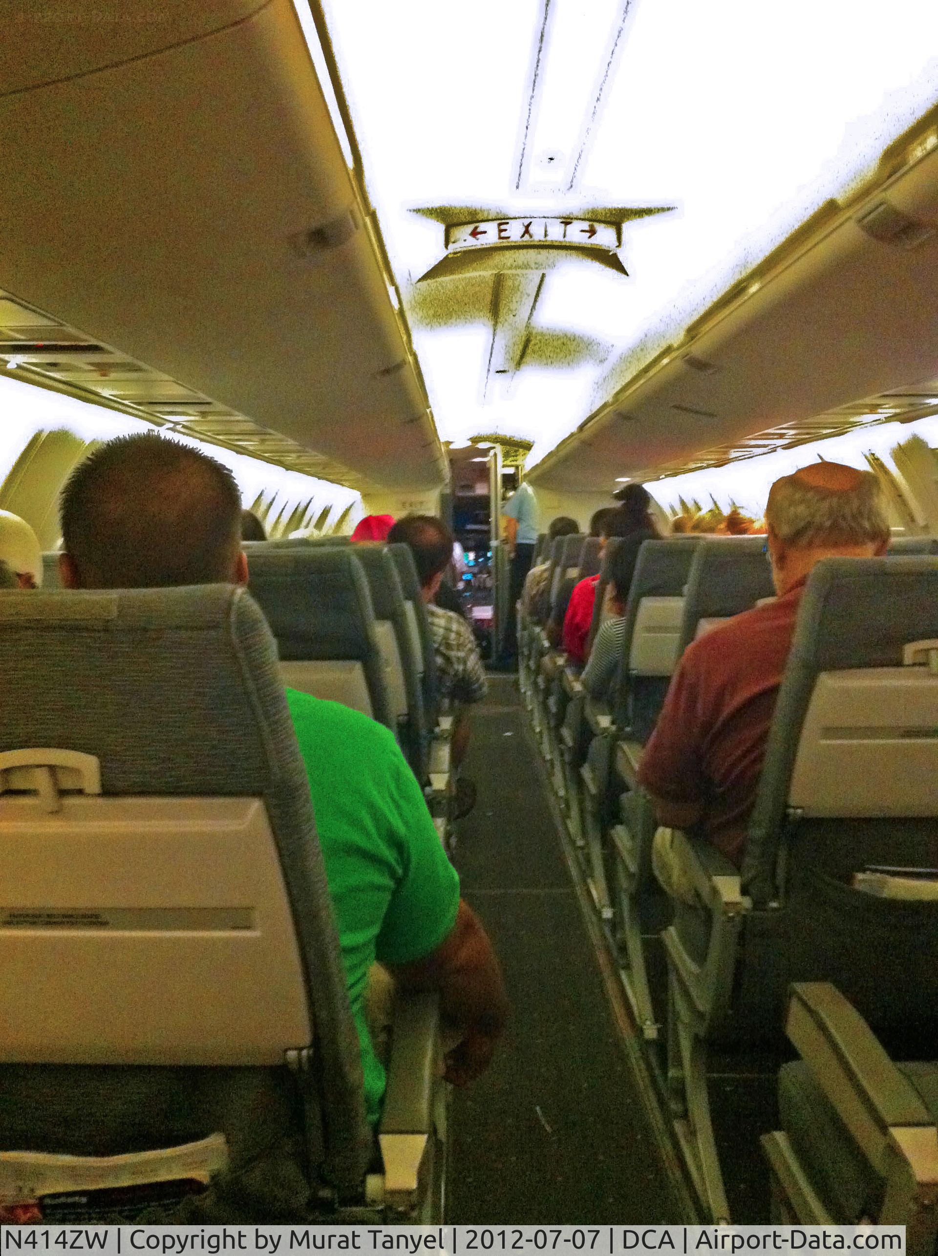 N414ZW, 2001 Bombardier CRJ-200LR (CL-600-2B19) C/N 7586, The captain waits for the paperwork.
