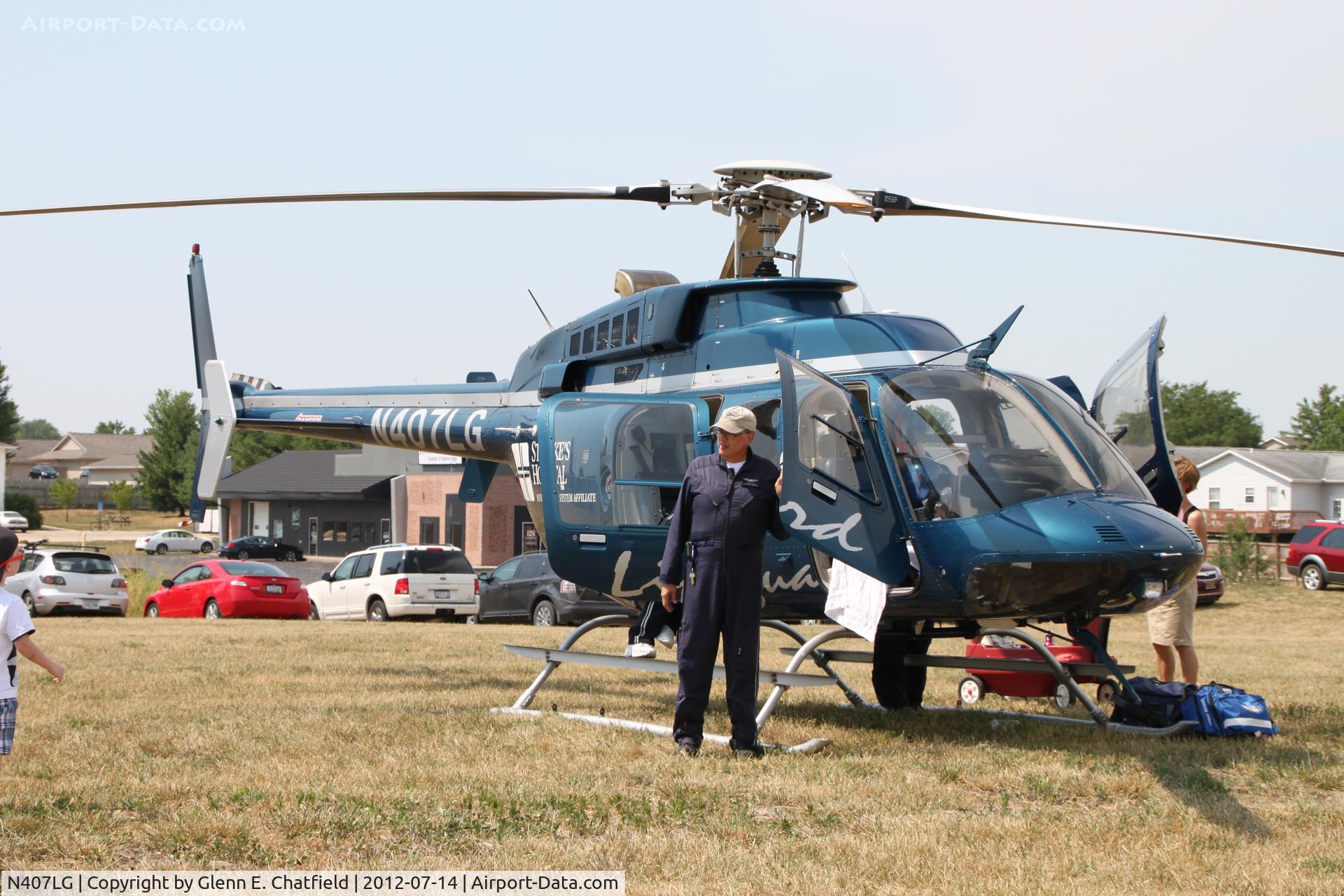 N407LG, 1997 Bell 407 C/N 53143, On display in North Liberty, IA, during the grand opening of a shopping center.