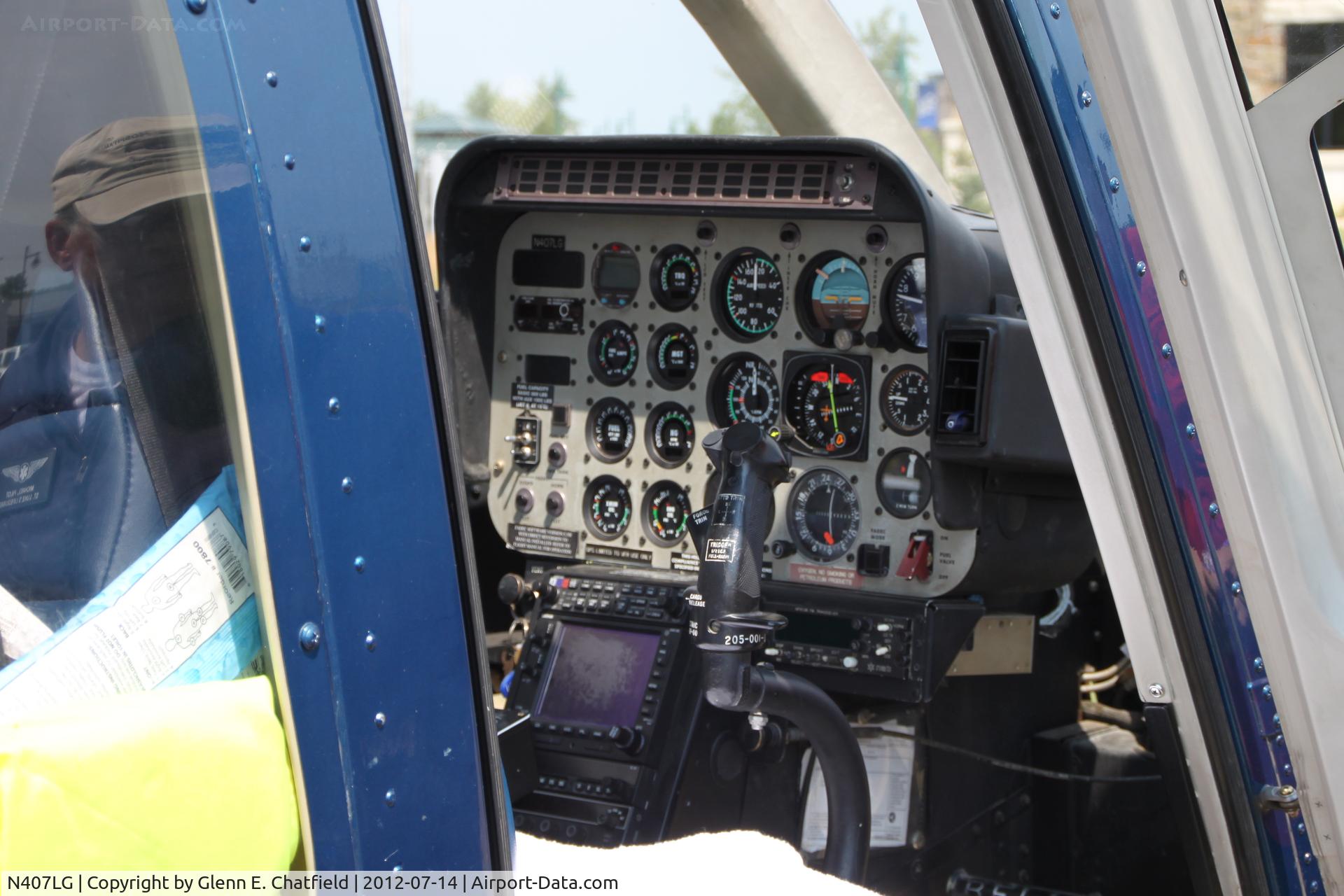 N407LG, 1997 Bell 407 C/N 53143, On display at North Liberty, IA during grand opening of local shopping center.