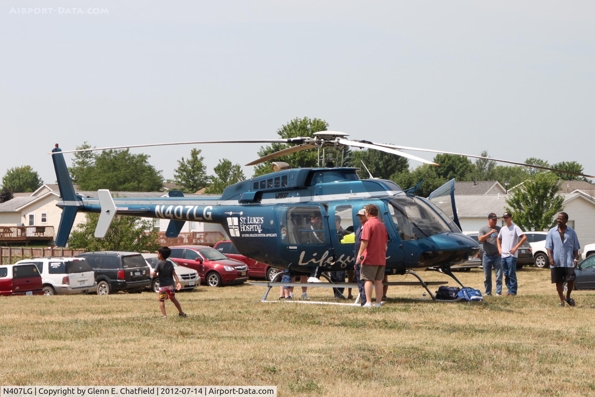 N407LG, 1997 Bell 407 C/N 53143, On display at North Liberty, IA during grand opening of local shopping center.
