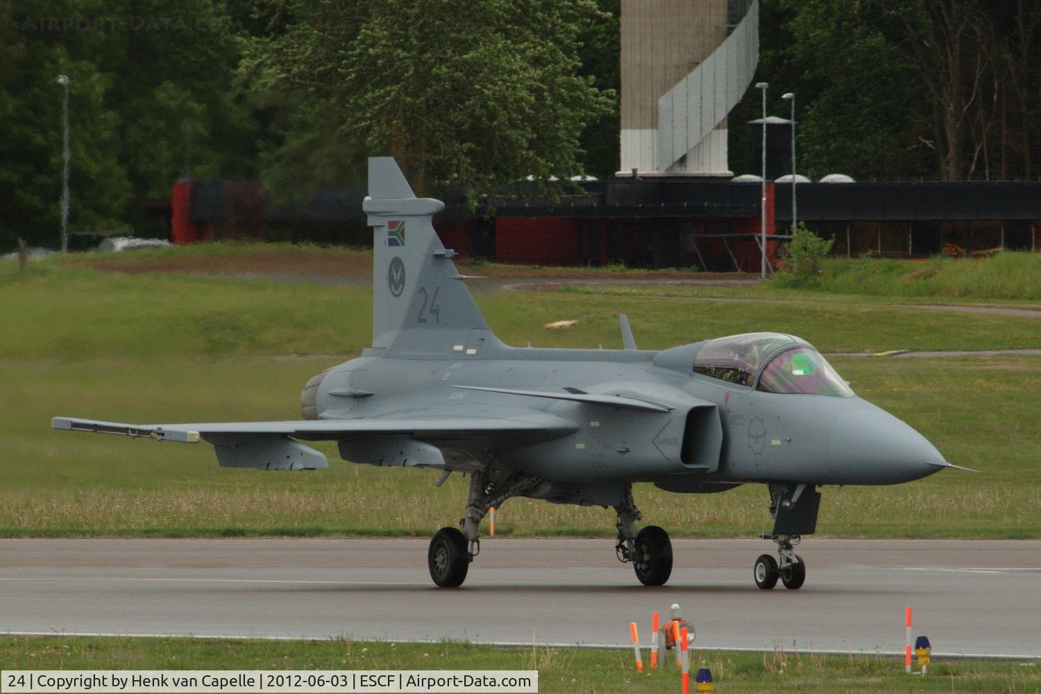 24, Saab JAS-39C Gripen C/N 392115, Saab Gripen of the South African Air Force taxying at Malmen Air Base, Sweden.