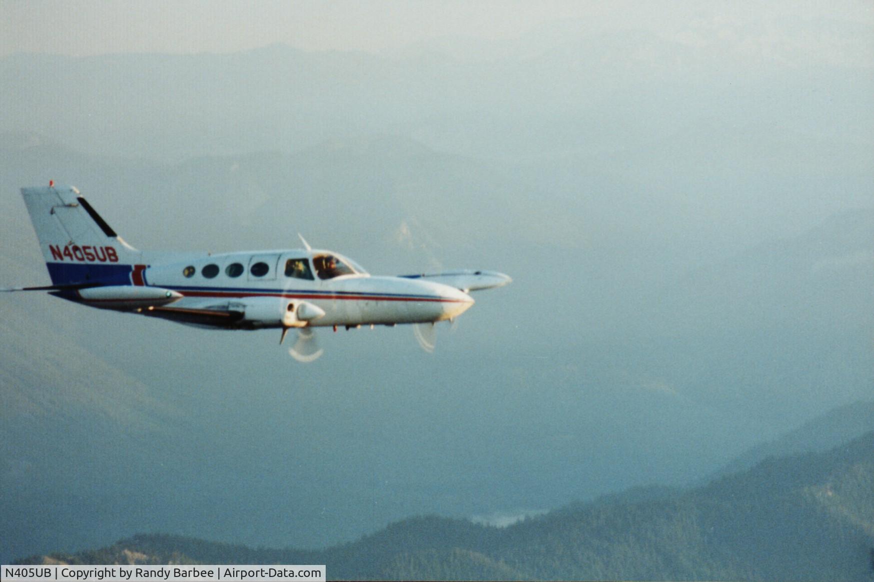 N405UB, 1969 Cessna 402A C/N 402A0027, Flying cargo near Mt. Rainier early 90's