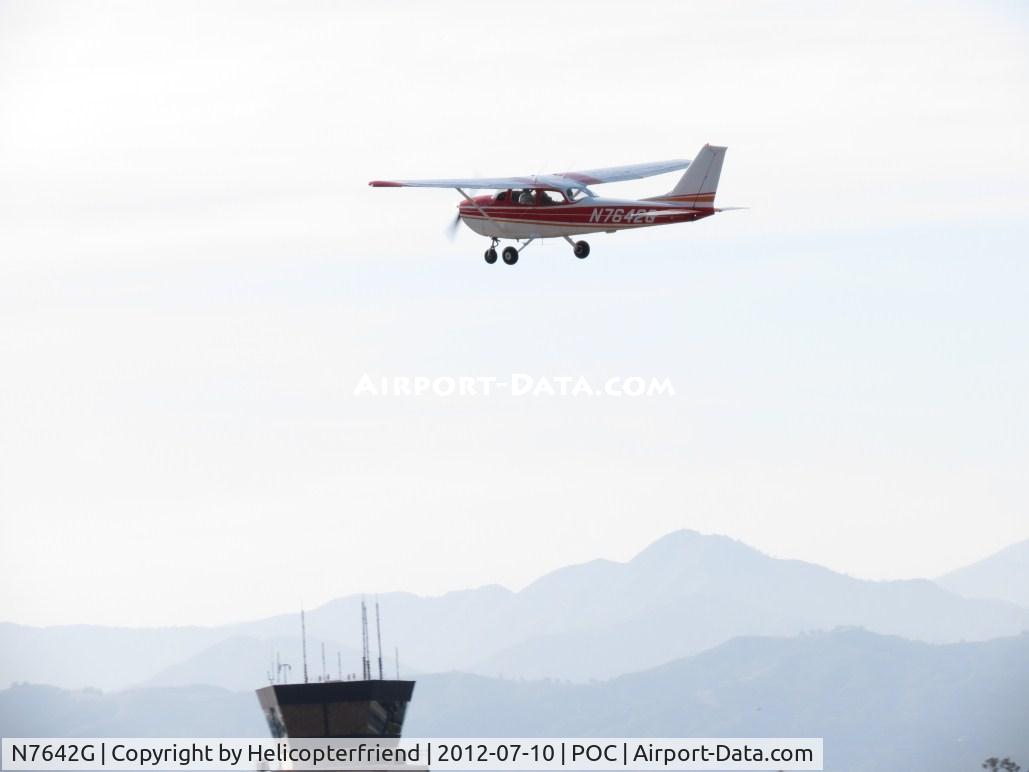 N7642G, 1970 Cessna 172L C/N 17259342, Climbing out passing above the tower
