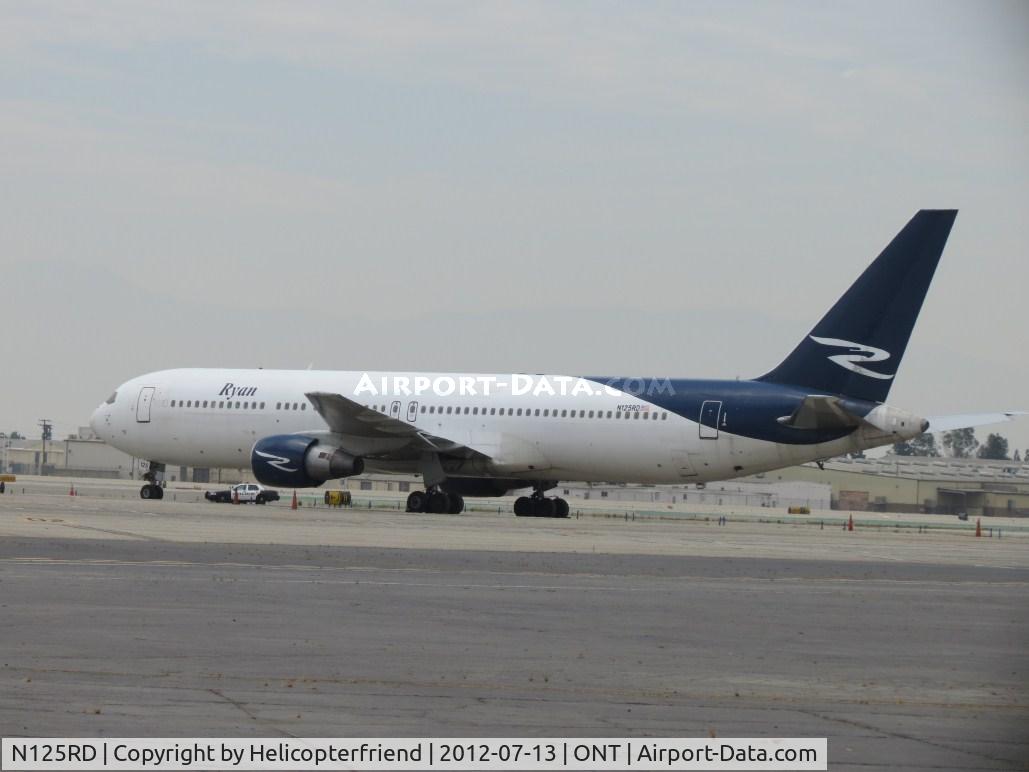 N125RD, 1990 Boeing 767-383/ER C/N 24849, Appeared to be Military personnel waiting west of the area to possibly load