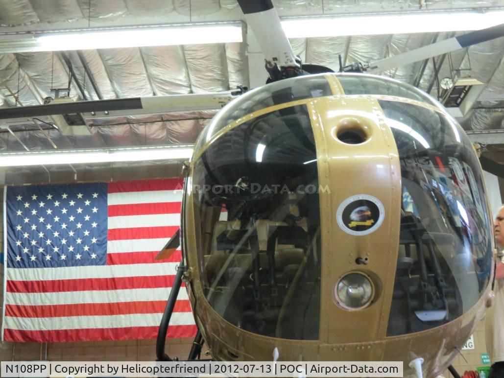 N108PP, 2008 MD Helicopters 369E C/N 0578E, Parked in her hanger by her flag