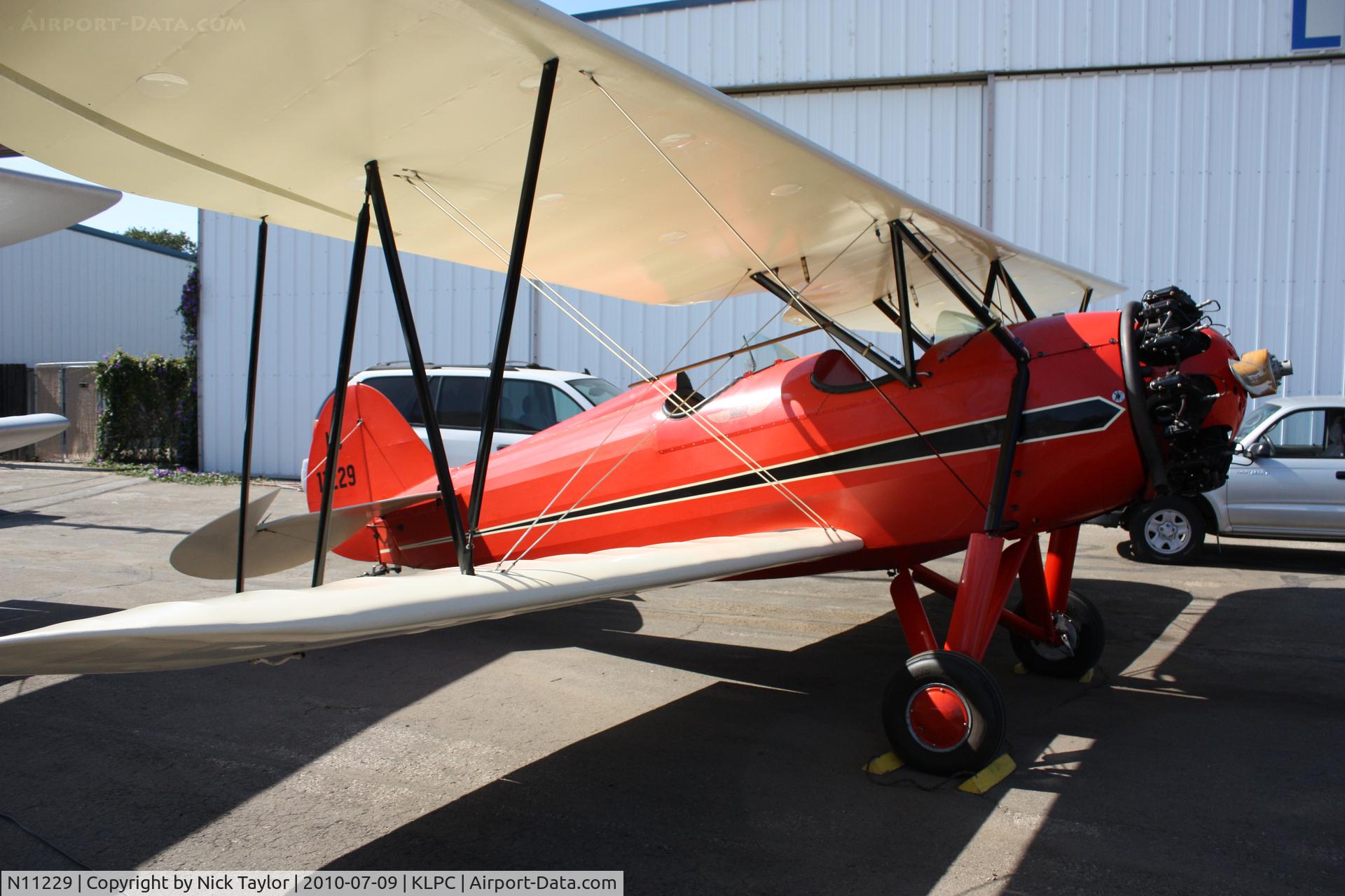 N11229, Waco RNF C/N 3456, Lompoc Piper Cub fly in 2010