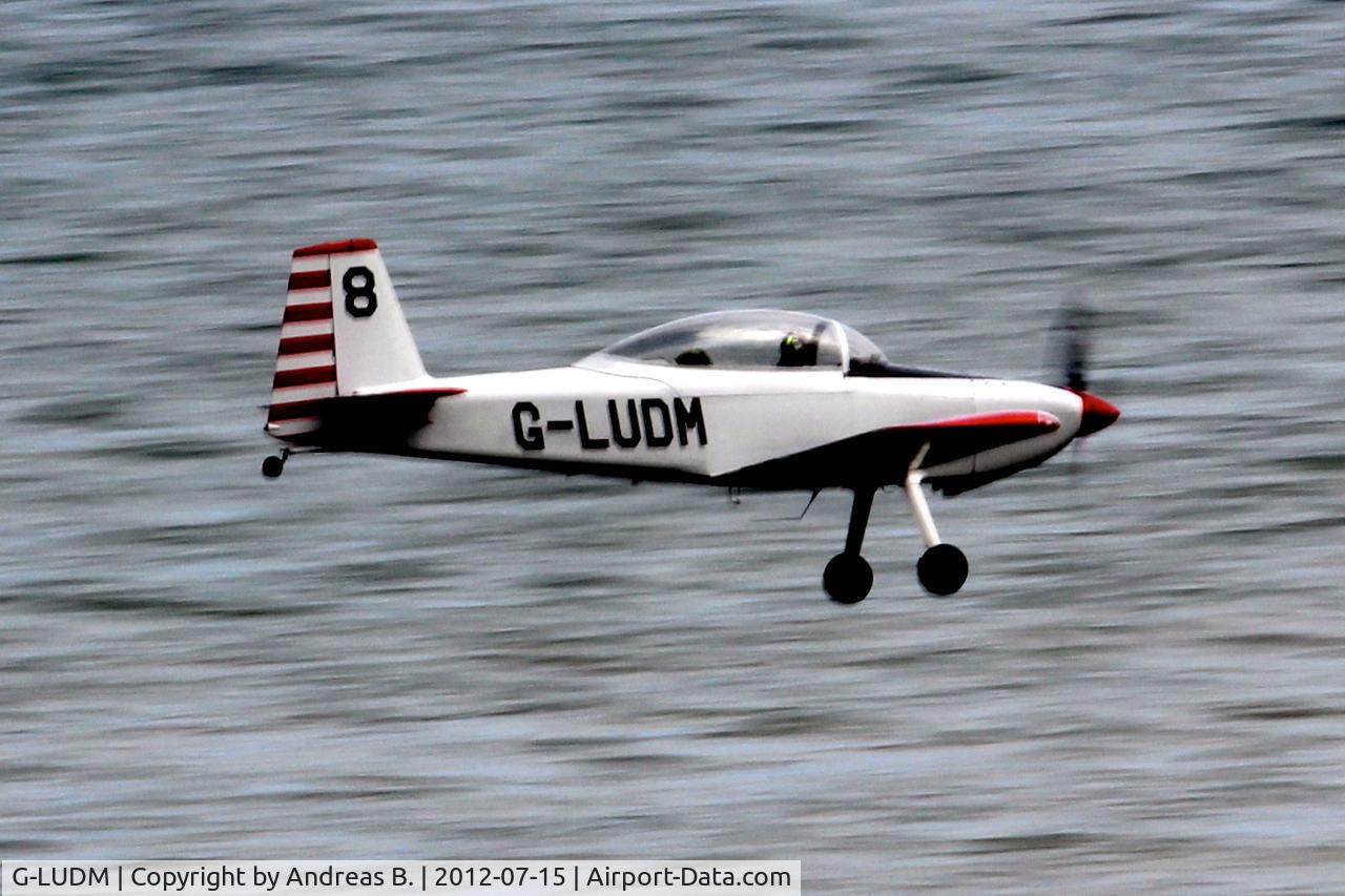 G-LUDM, 2006 Vans RV-8 C/N PFA 303-14521, Shot taken from camping field beside caravan park in Happisburgh.