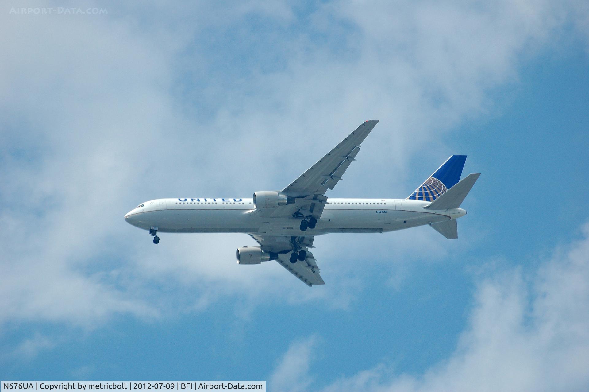 N676UA, 2001 Boeing 767-322 C/N 30028, in flight over BFI