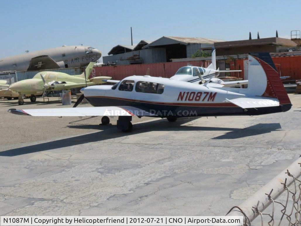 N1087M, 1990 Mooney M20M Bravo C/N 27-0047, Parked inside the parking area for the paintshop
