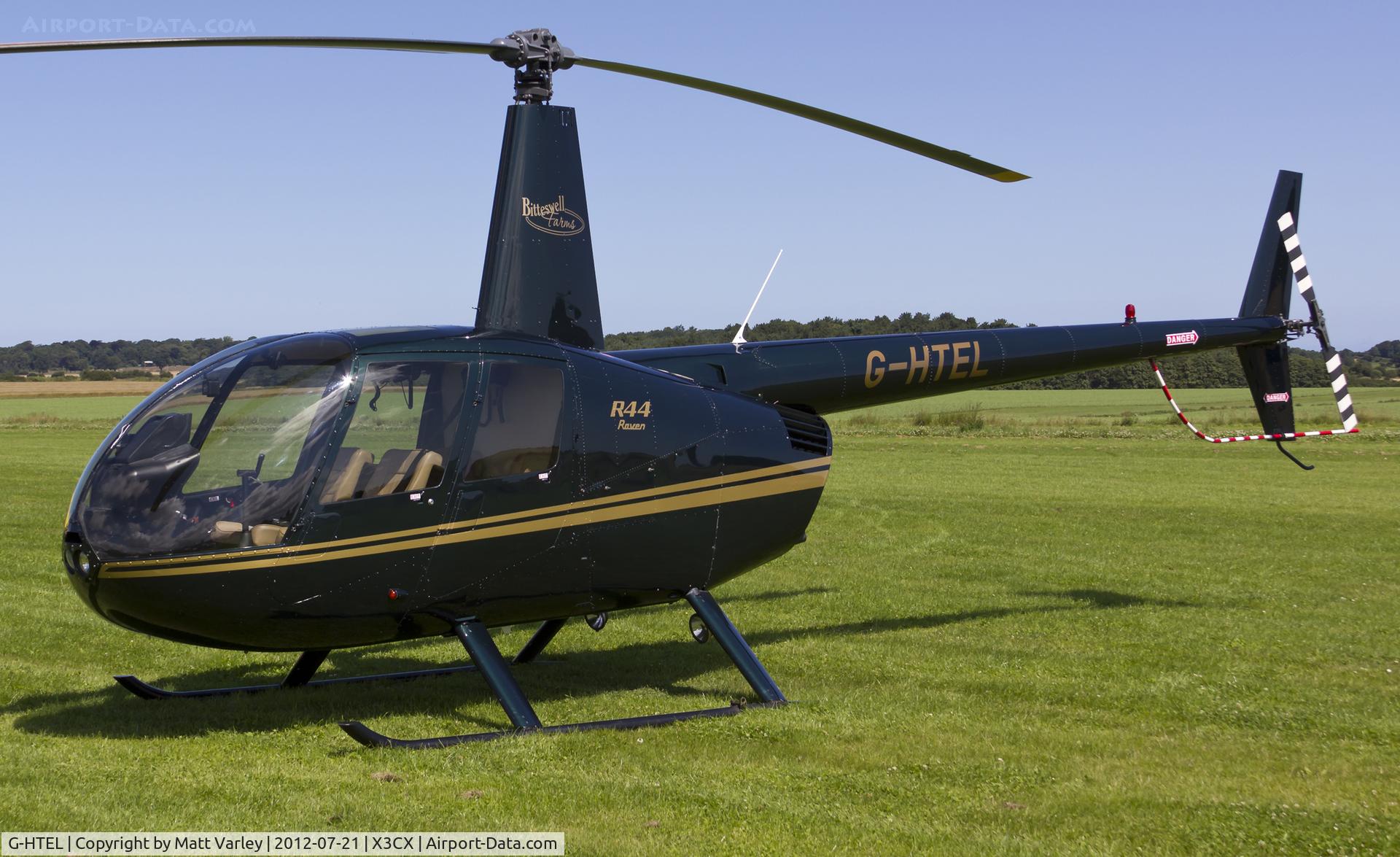 G-HTEL, 2002 Robinson R44 Raven C/N 1155, Sat at Northrepps.