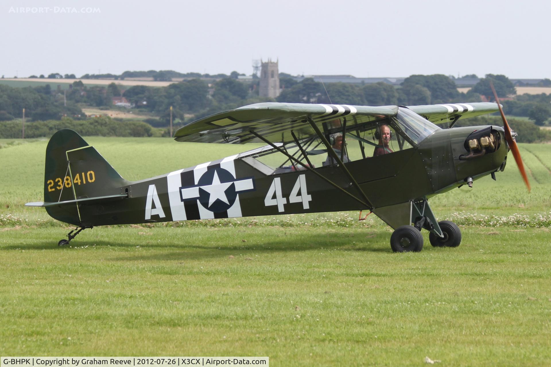 G-BHPK, 1943 Piper L-4H Grasshopper (J3C-65D) C/N 12161, Just landed.