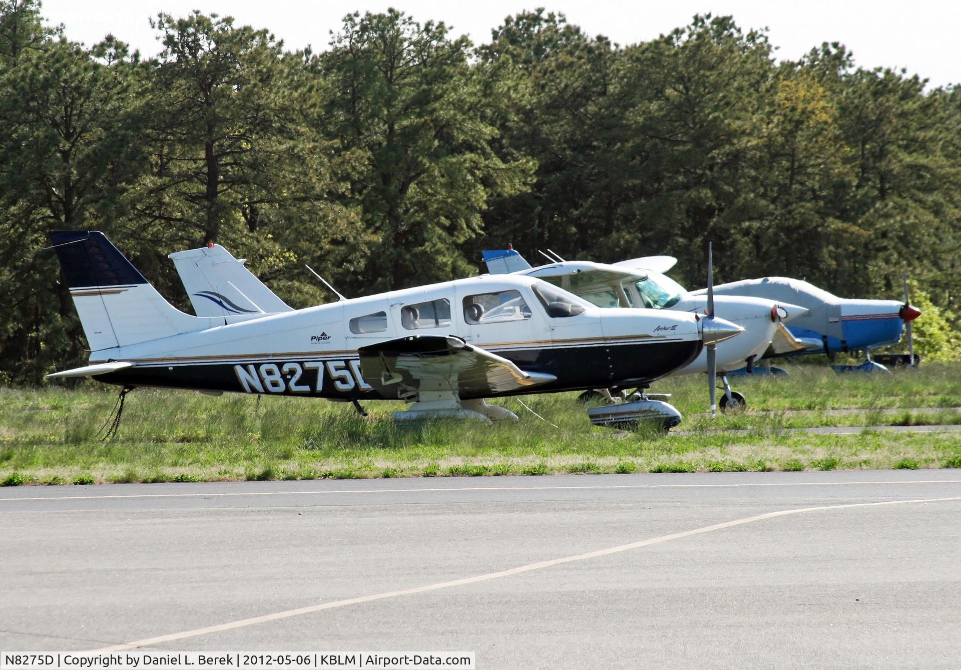 N8275D, 1997 Piper PA-28-181 C/N 2843096, A Piper Archer II heads up a gaggle of general aviation aircraft at Monmouth Executive Airport.