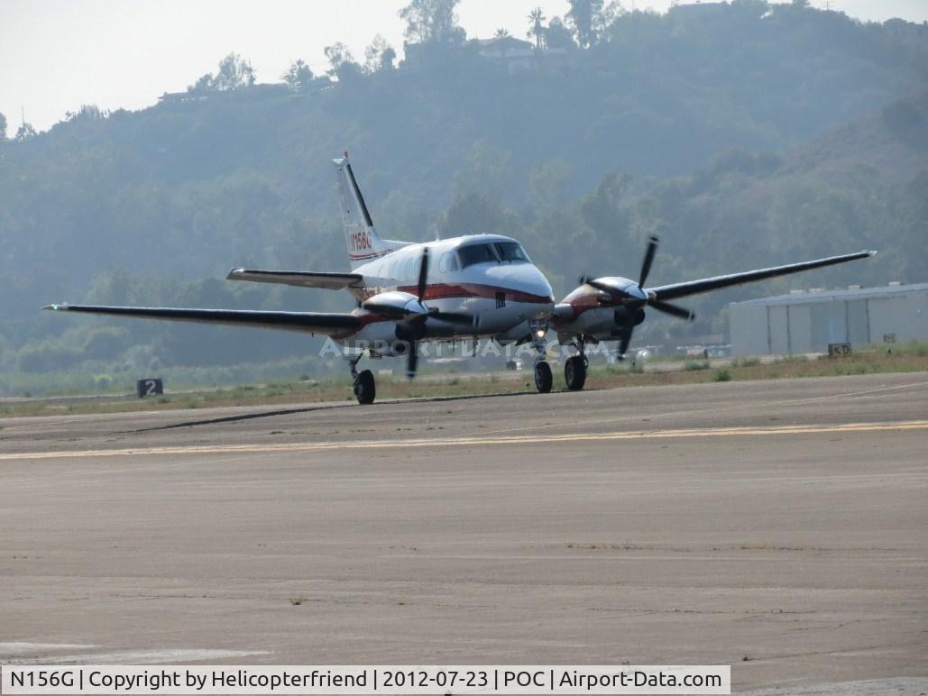 N156G, 1975 Beech E-90 King Air C/N LW-156, On taxiway Sierra heading to runway 26L