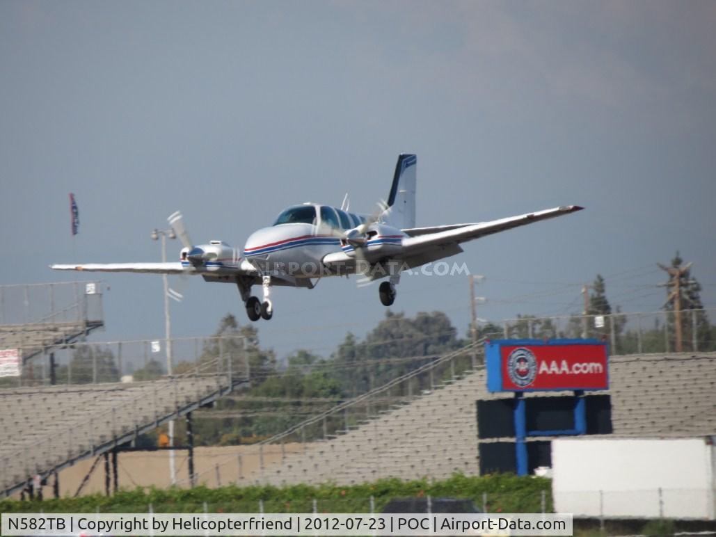 N582TB, 1997 Beech 58 Baron C/N TH-1837, On final, over the outer fence for 26L