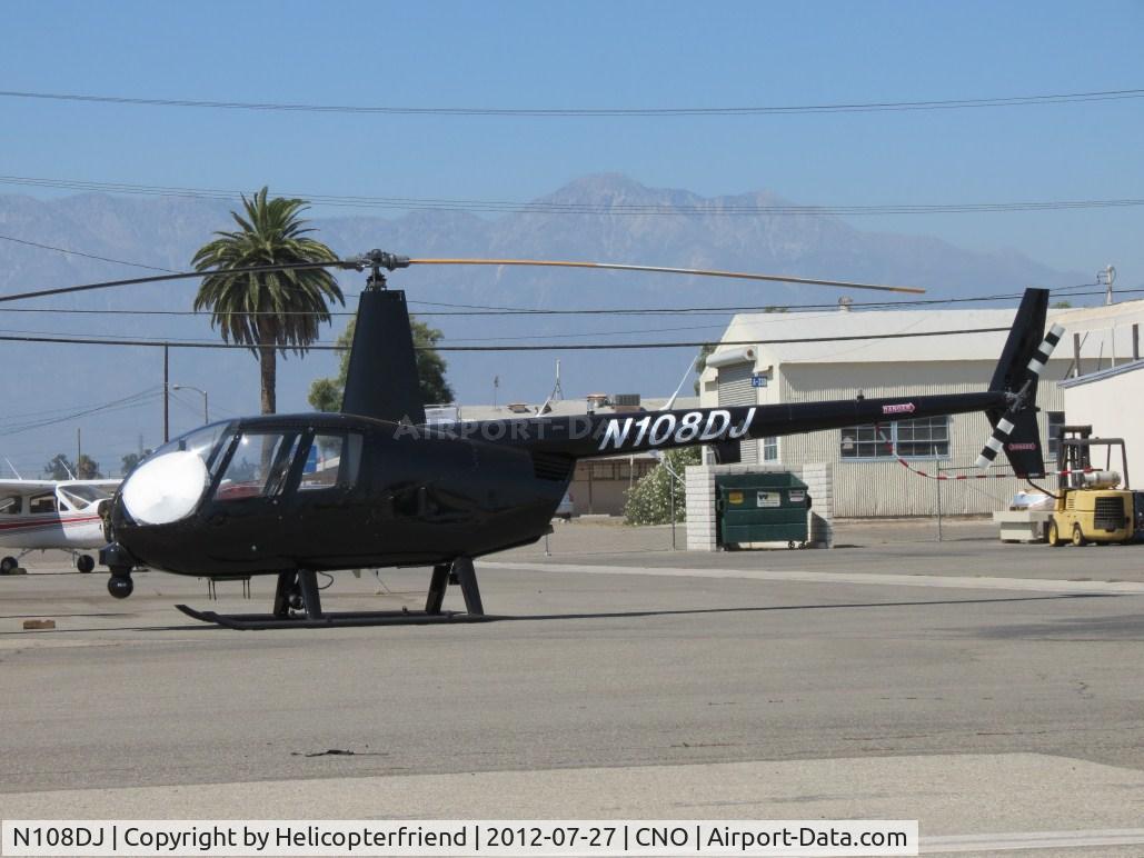 N108DJ, 2001 Robinson R44 C/N 1060, Parked with a sunshade partially blocking the sun