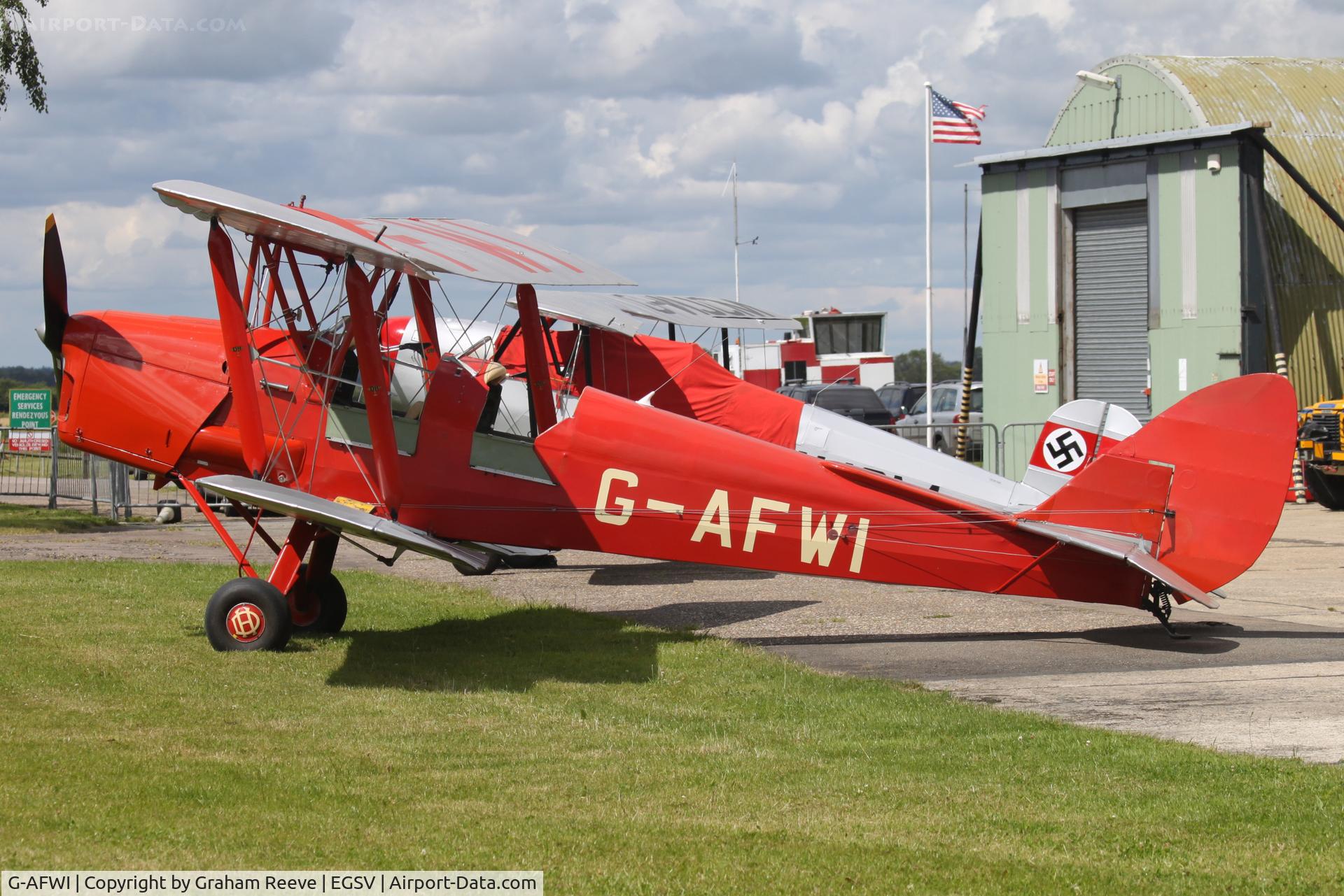 G-AFWI, 1939 De Havilland DH-82A Tiger Moth II C/N 82187, Parked in the sun.