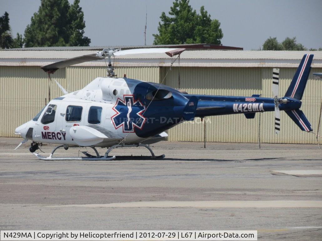 N429MA, 1984 Bell 222UT C/N 47523, Parked in Mercy Air parking area with 2 other Bell 222