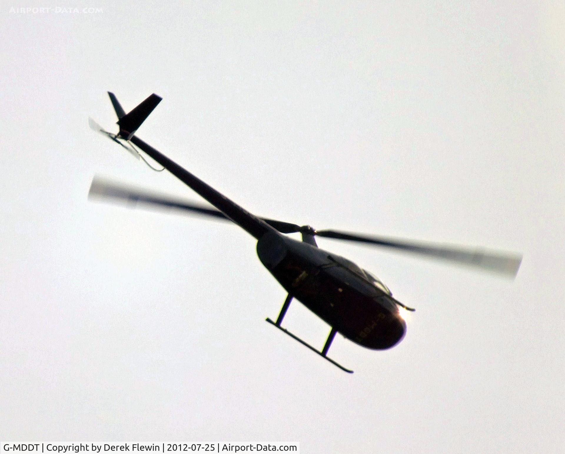 G-MDDT, 2006 Robinson R44 Raven II C/N 11474, Landside, Overflying our camp site in Exebridge Devon.