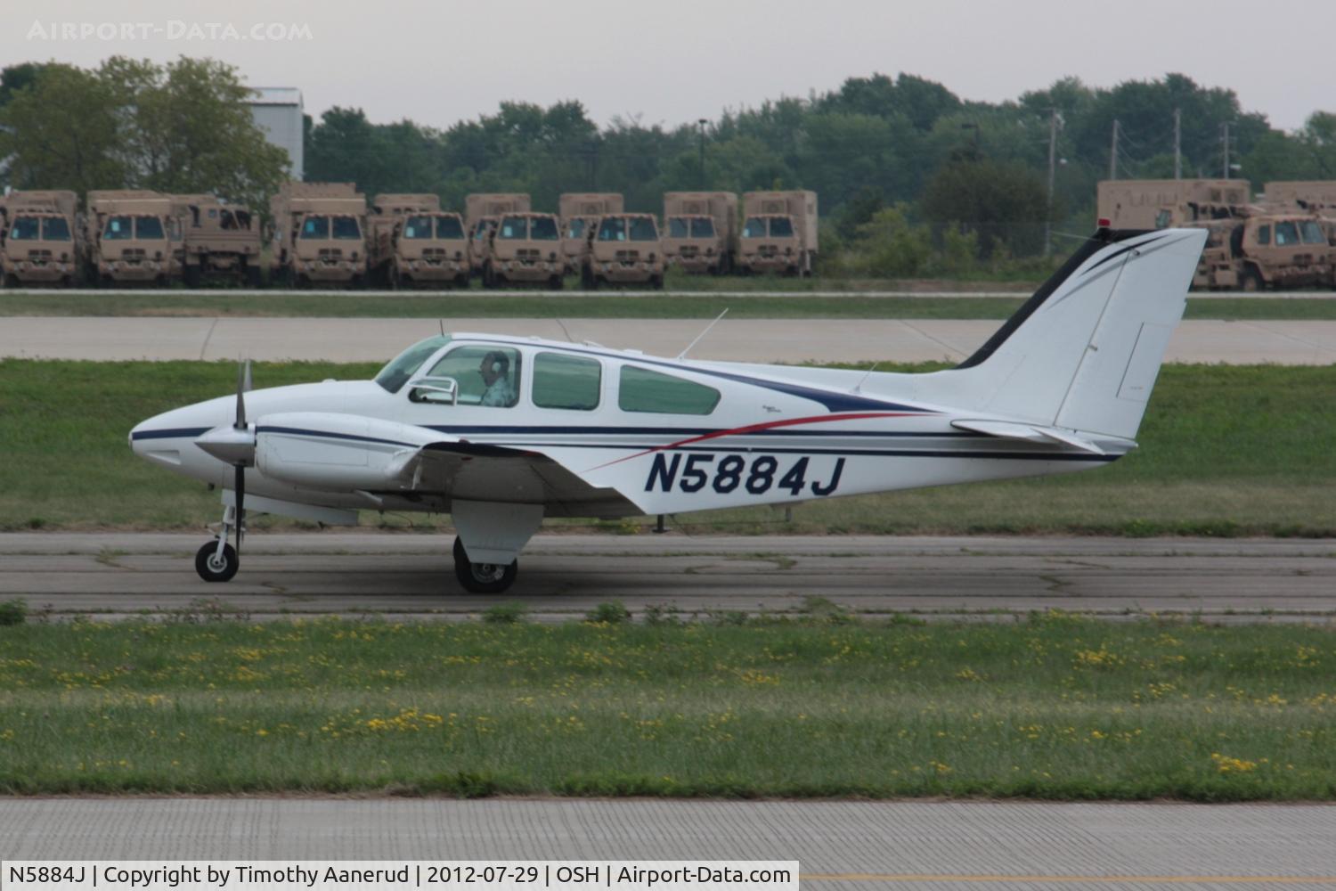N5884J, 1965 Beech 95-B55 (T42A) Baron C/N TC-926, Departing Airventure 2012