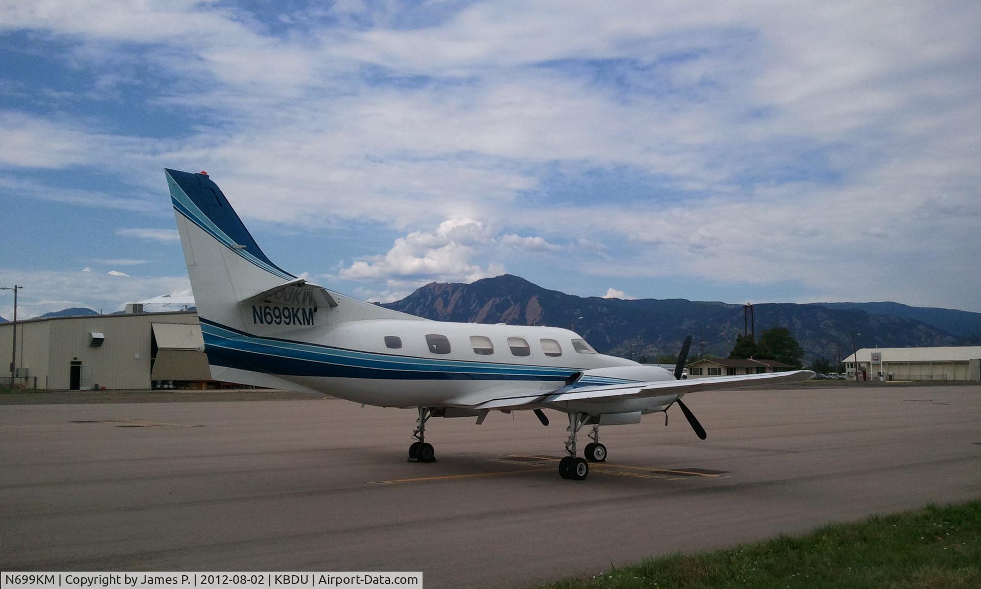 N699KM, 1975 Swearingen SA-226T Merlin IIIA C/N T256, Back drop is the Boulder Flatirons