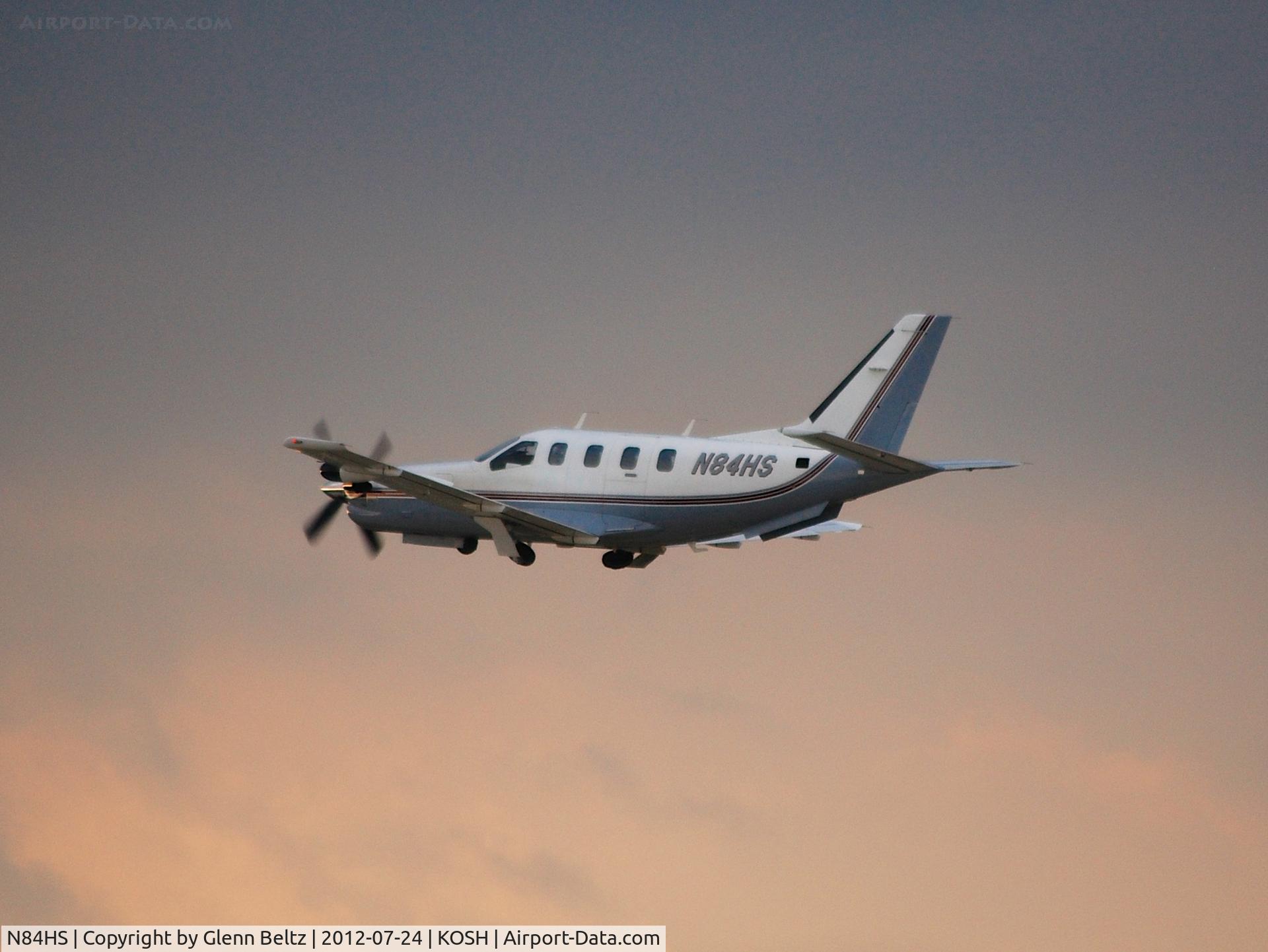 N84HS, Socata TBM-700 C/N 50, Departing EAA Airventure/Oshkosh on 24 July 2012.