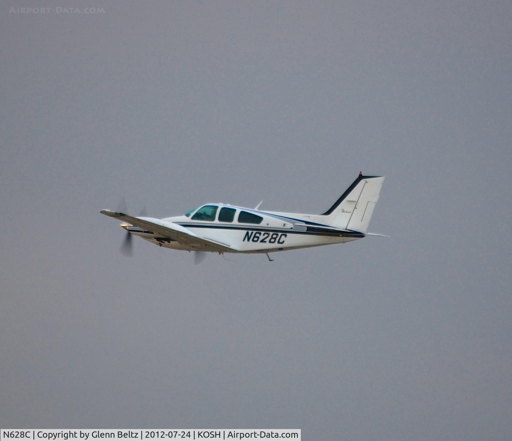 N628C, 1977 Beech 95-B55 (T42A) Baron C/N TC-2052, Departing EAA Airventure/Oshkosh on 24 July 2012.