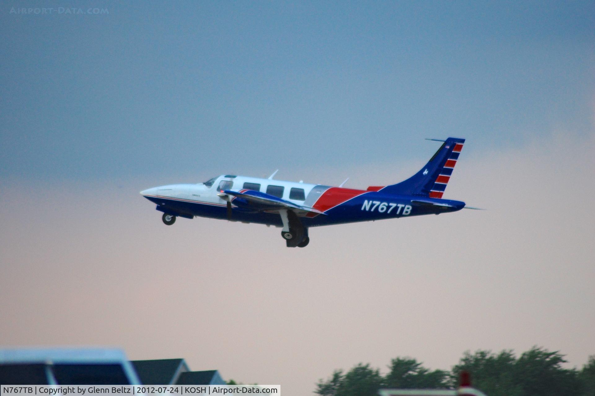 N767TB, 1976 Smith Aerostar 601P C/N 61P-0350-106, Departing EAA Airventure/Oshkosh on 24 July 2012.