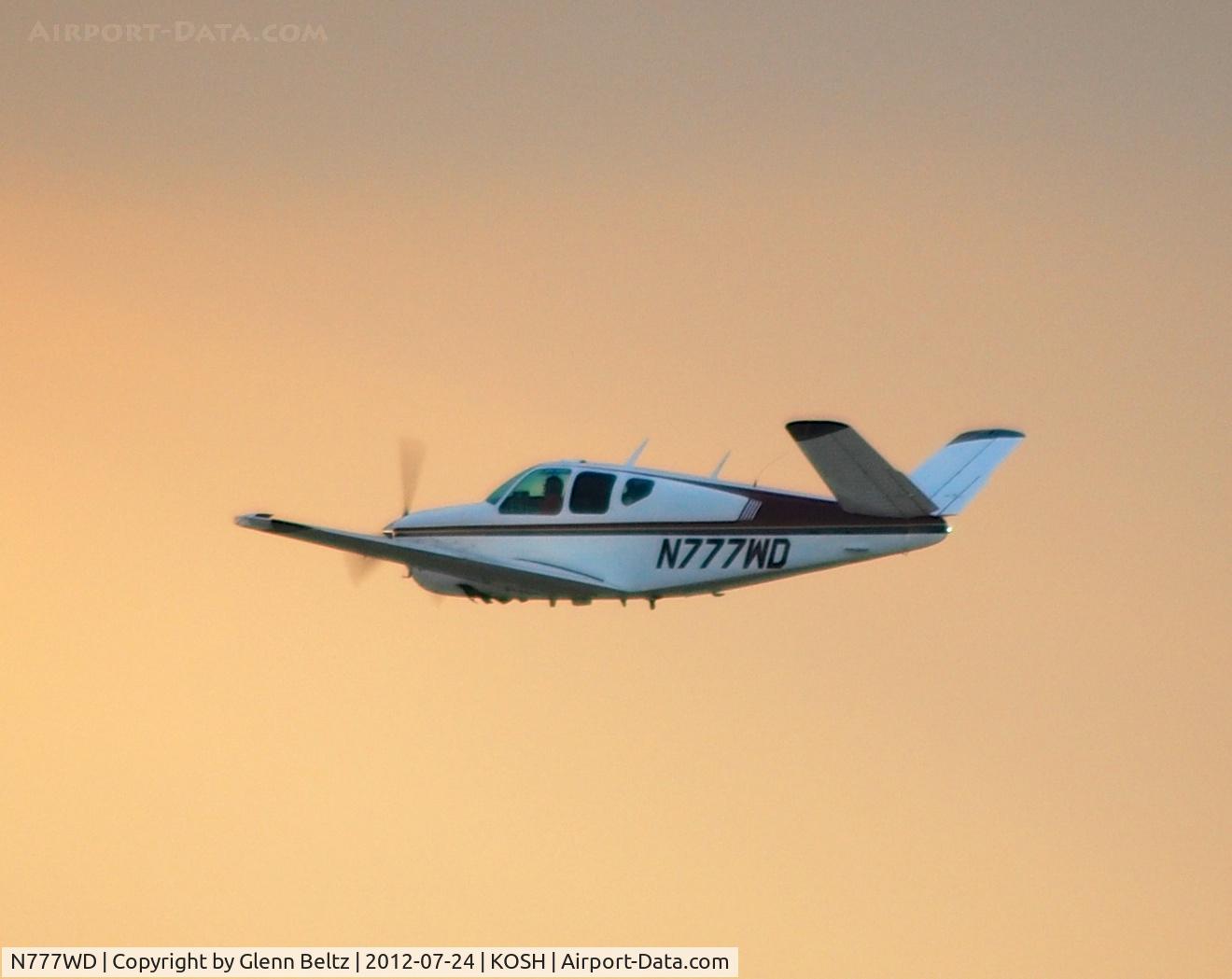 N777WD, 1960 Beech M35 Bonanza C/N D-6491, Departing EAA Airventure/Oshkosh on 24 July 2012.