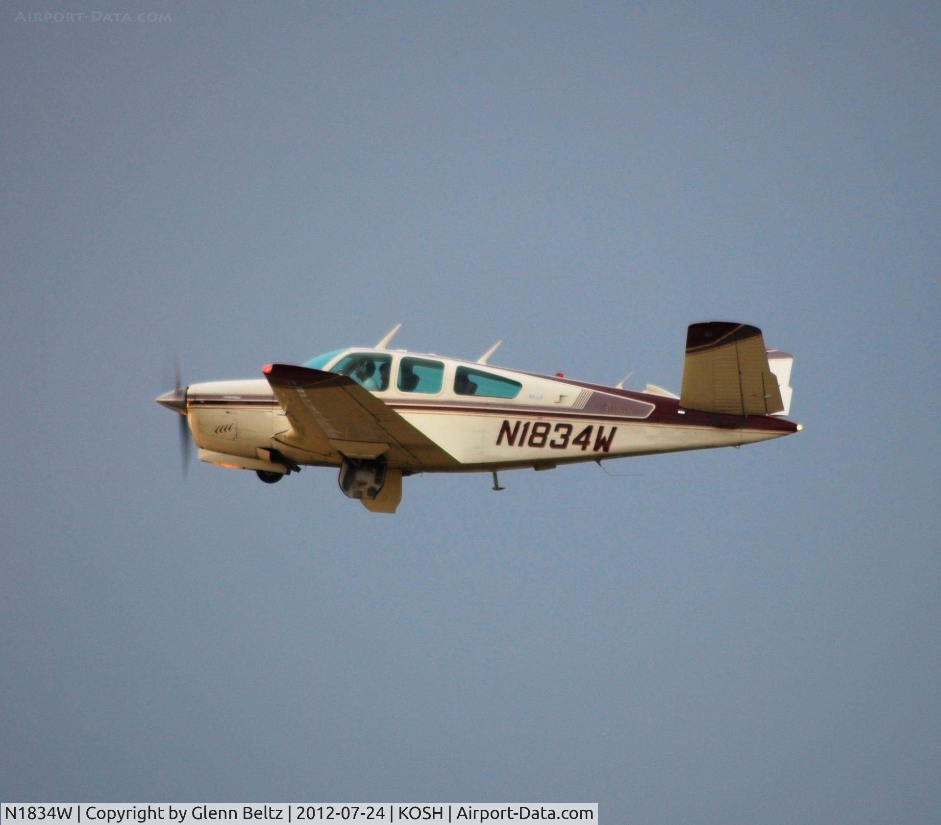 N1834W, 1973 Beech V35B Bonanza C/N D-9429, Departing EAA Airventure/Oshkosh on 24 July 2012.