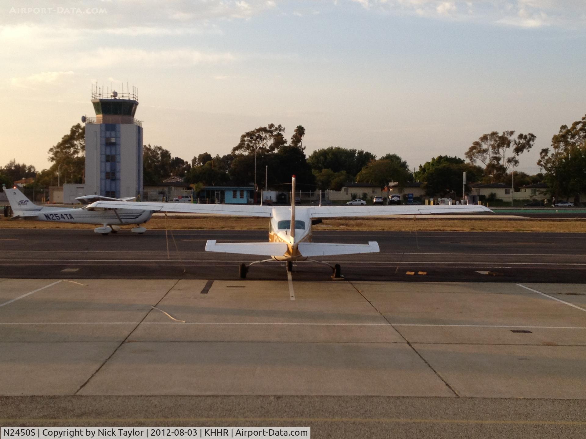 N2450S, 1976 Cessna T210L Turbo Centurion C/N 21061291, Parked on the south side while N245TA taxis by.