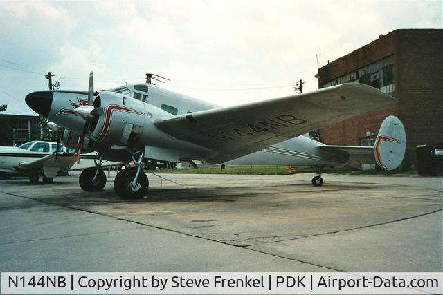 N144NB, 1955 Beech E18S C/N BA-39, Photo taken in the 1990s with a 35mm SLR Pentax.  The aircraft was on the apron at PDK in Atlanta, GA
