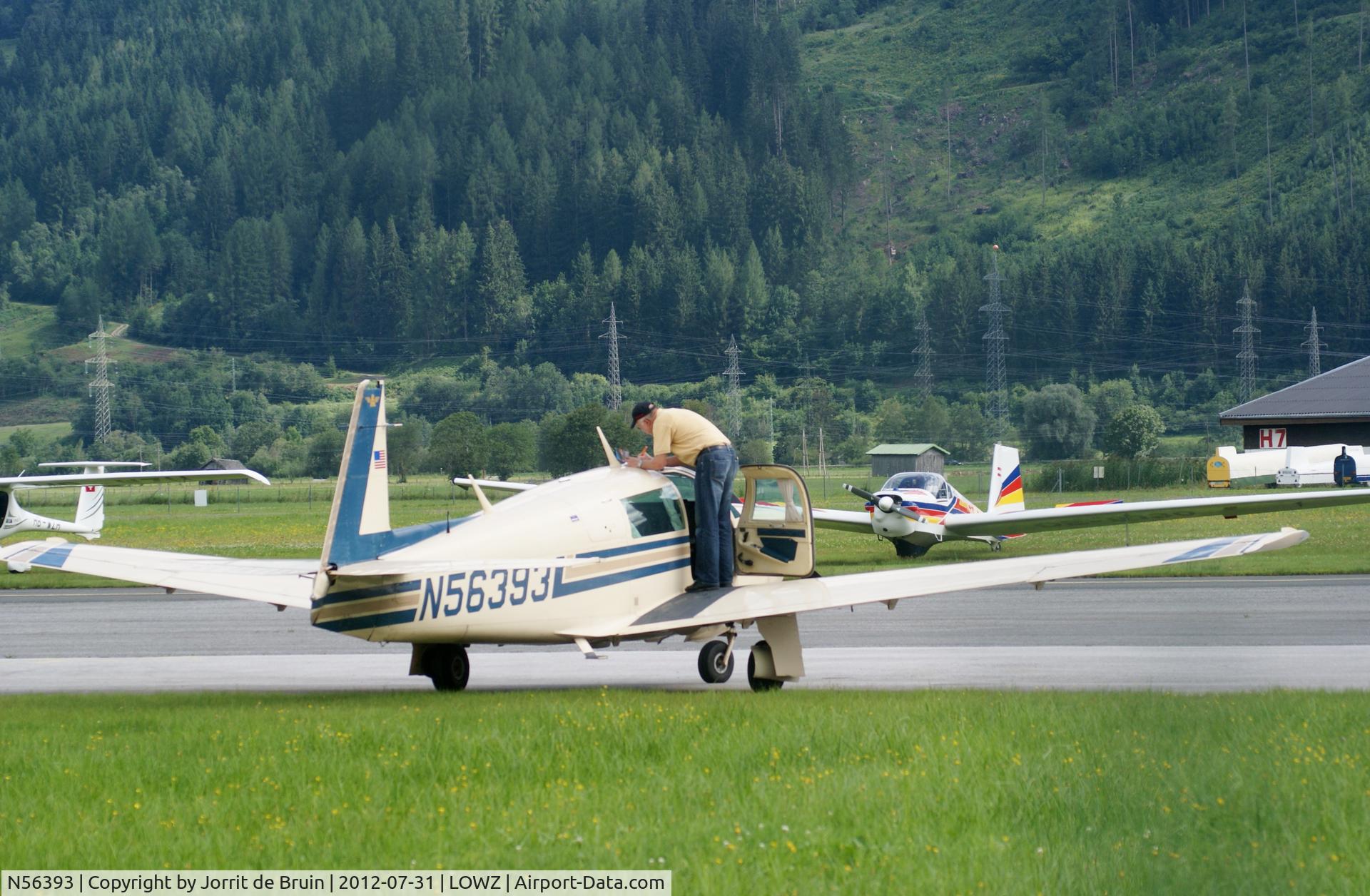 N56393, 1983 Mooney M20J 201 C/N 24-1377, The American Mooney has the curtains a bit of front the windows, to protect it from the sun.