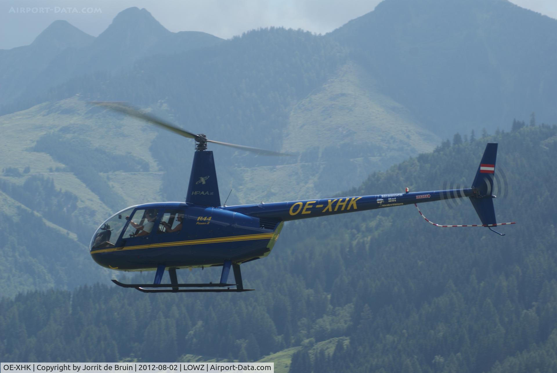 OE-XHK, 2008 Robinson R44 Raven II C/N 12375, The four persons Robinson helicopter is landing direct on the Helicopter apron at Zell am See.