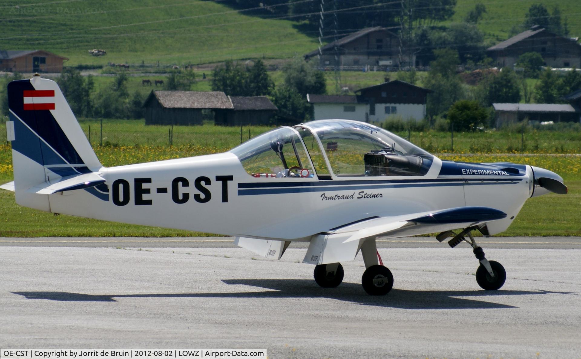 OE-CST, 1994 Brandli BX-2 Cherry C/N 125, The window a bit open, because of sunny warm Zell am See. The blue-white Cherry is now waiting for his turn to use the fuel station.