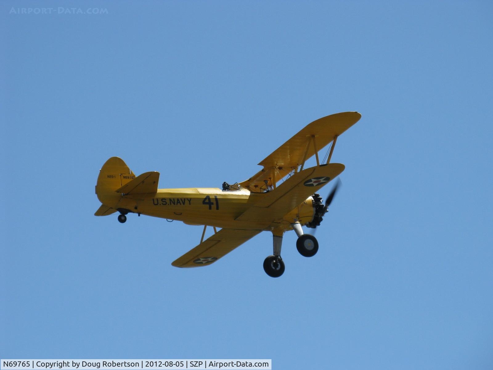 N69765, 1941 Boeing A75N1 (PT17) C/N 75-1044, 1941 Boeing Stearman A75N1 as Navy N2S1, Continental W670 220 Hp, takeoff climb Rwy 22
