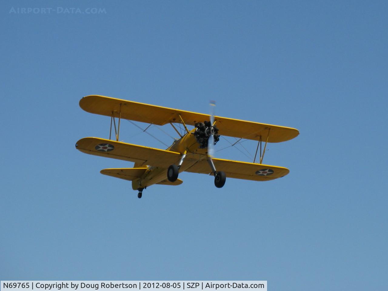 N69765, 1941 Boeing A75N1 (PT17) C/N 75-1044, 1941 Boeing Stearman A75N1 as Navy N2S1, Continental W670 220 Hp, takeoff climb Rwy 22