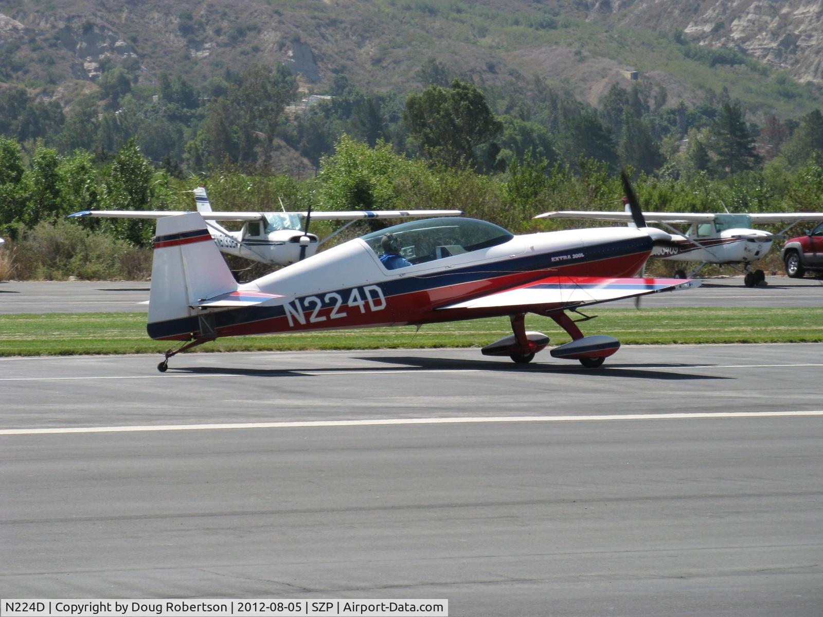 N224D, 1996 Extra EA-300/L C/N 028, 1996 EXTRA Fleugzeugbau Gmbh EA 300/L low-wing version, Lycoming AEIO-540-L1B5 300 Hp, landing roll Rwy 22. EXTRA also makes an EA 300/S short wing version and an EA 300 mid-wing version.
