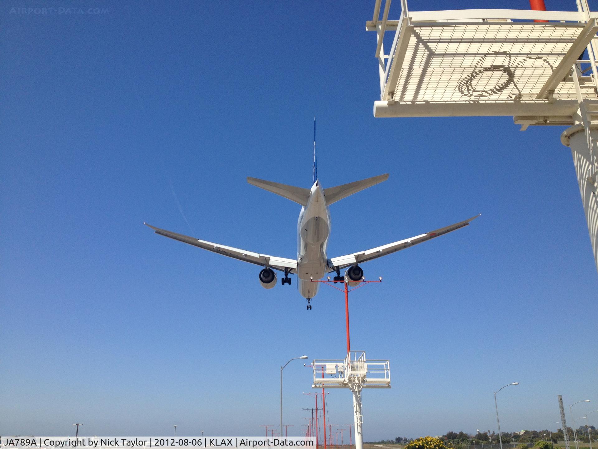JA789A, 2010 Boeing 777-381/ER C/N 40687, Landing 24R