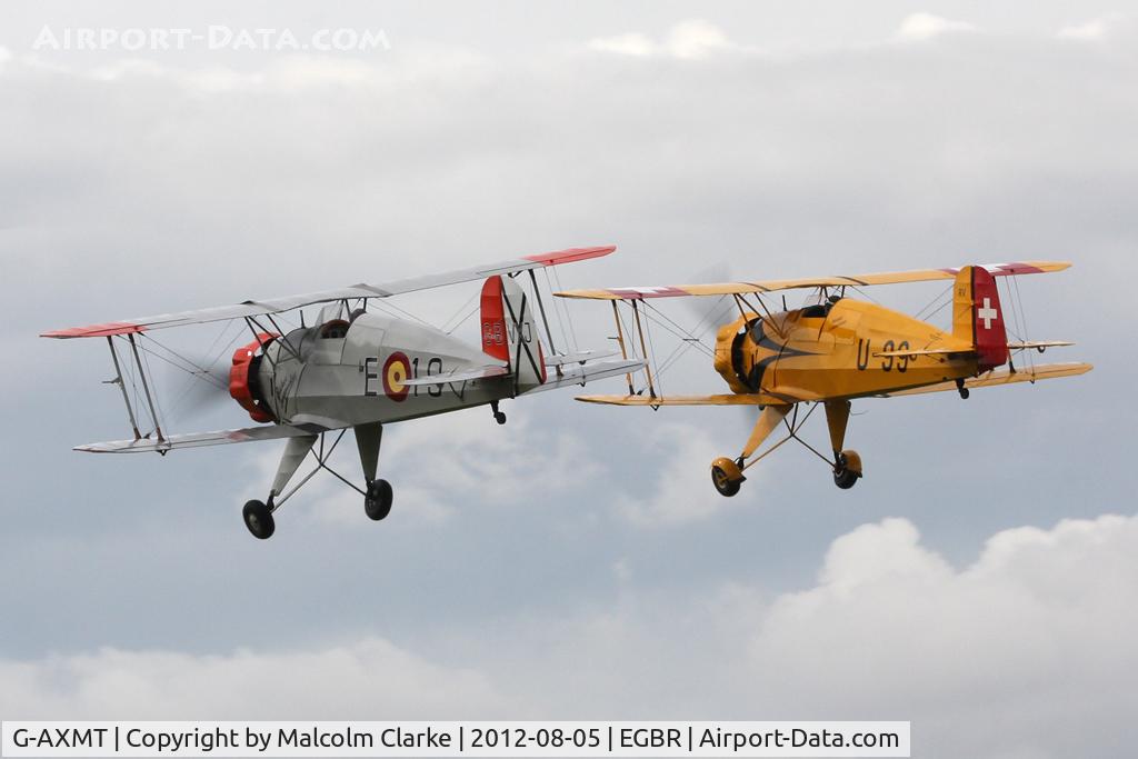 G-AXMT, 1938 Bucker Bu-133C Jungmeister C/N 46, Doflug Bu-133C Jungmeister with CASA 1-133C Jungmeister G-BVXJ at The Real Aeroplane Company's Summer Madness Fly-In, Breighton Airfield, August 2012.