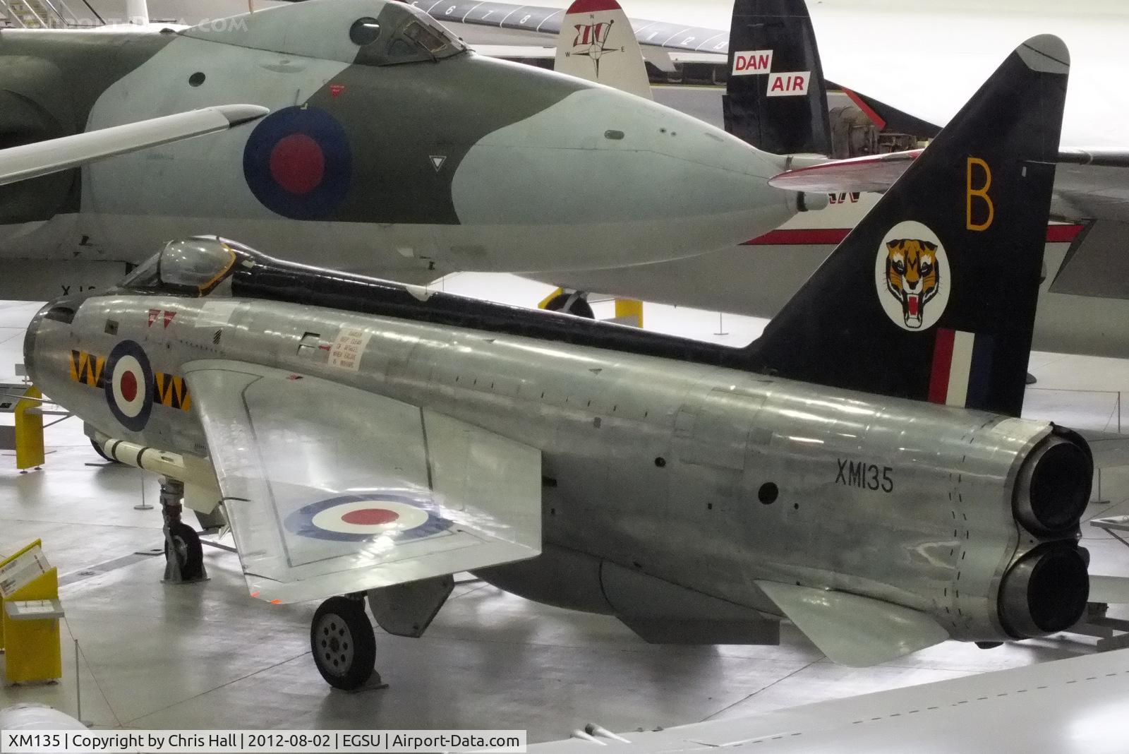XM135, 1959 English Electric Lightning F.1 C/N 95031, In 74 'Tiger' squadron colours displayed inside the AirSpace hangar, Duxford