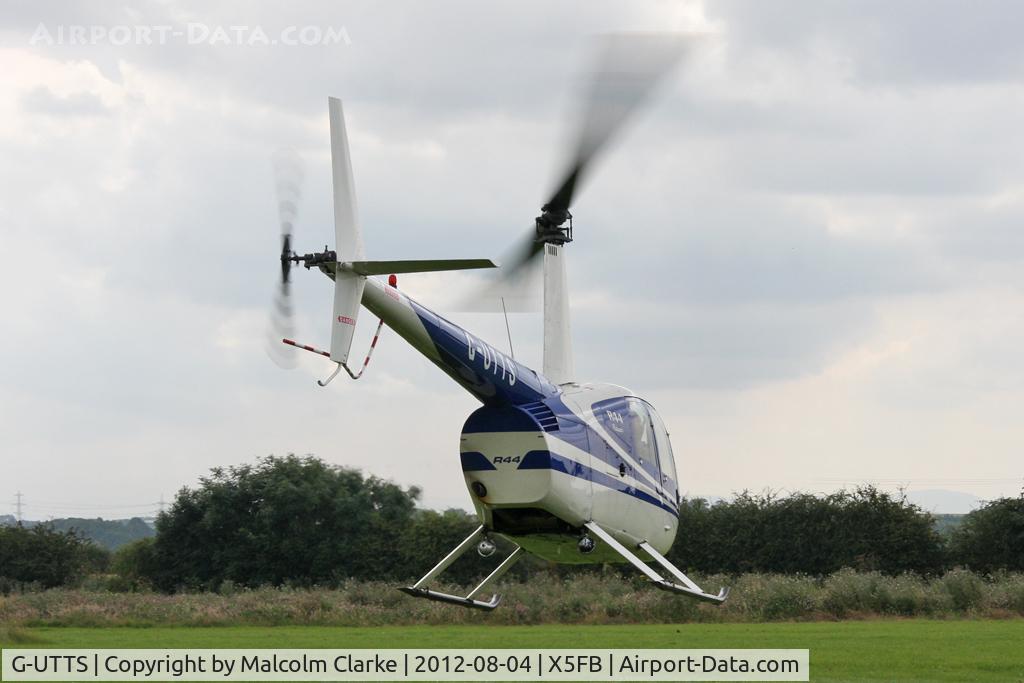 G-UTTS, 2000 Robinson R44 C/N 0865, Robinson R-44, Fishburn Airfield UK, August 2012.