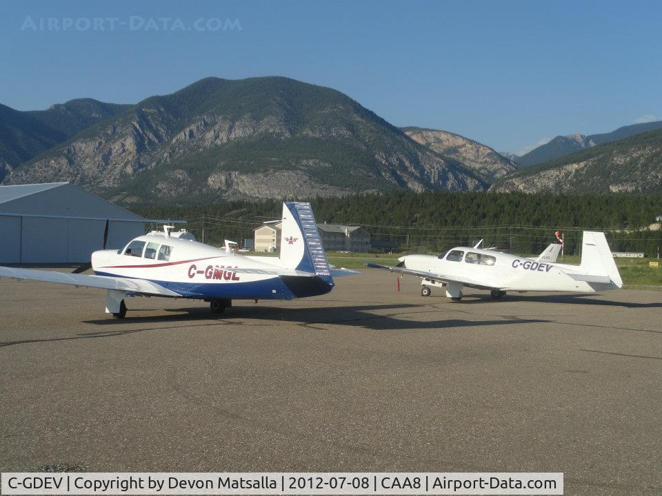 C-GDEV, 1990 Mooney M20M Bravo C/N 27-0067, C-GDEV and C-GMGL in Invermere