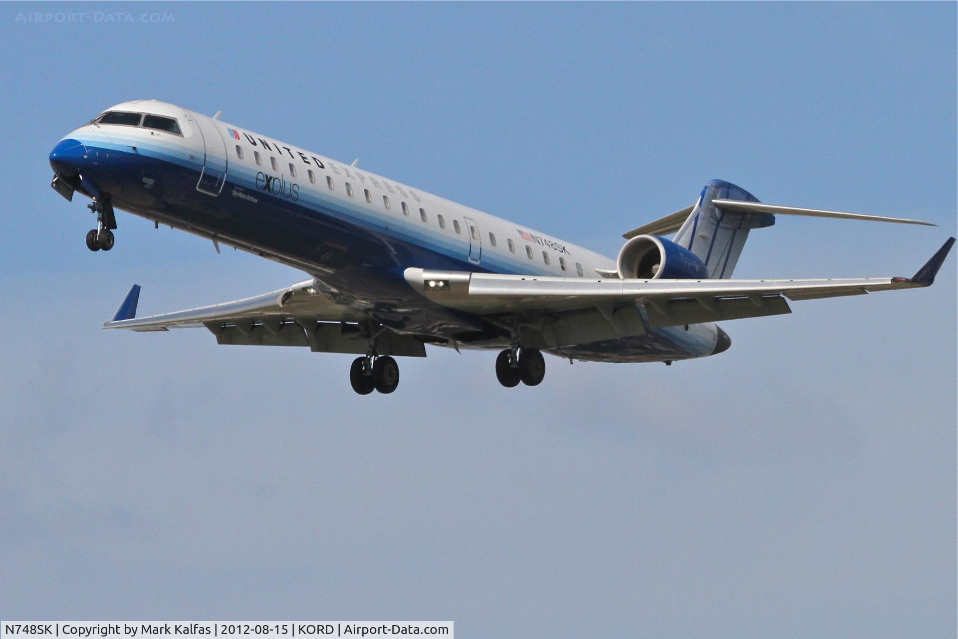 N748SK, 2005 Bombardier CRJ-700 (CL-600-2C10) Regional Jet C/N 10203, SkyWest/United Express Bombardier CL-600-2C10-CRJ7, SKW5644 arriving from Glacier Park International/KGPI, RWY 28 approach KORD.